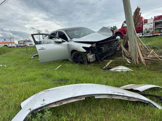 Friday crash takes out pole, sends occupants to hospital
