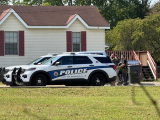Police: Carroll fired first in deadly standoff