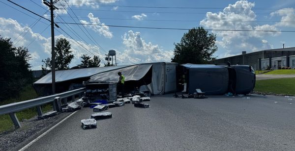Semi lands on side after swerving to avoid deer