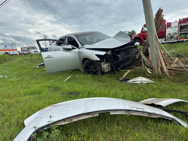 Friday crash takes out pole, sends occupants to hospital