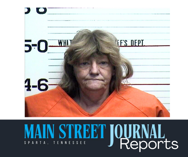 Woman charged after setting bed on fire
