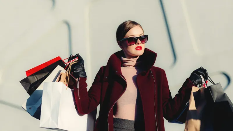 Women in fall coats outdoors — stop buying a new closet every holiday