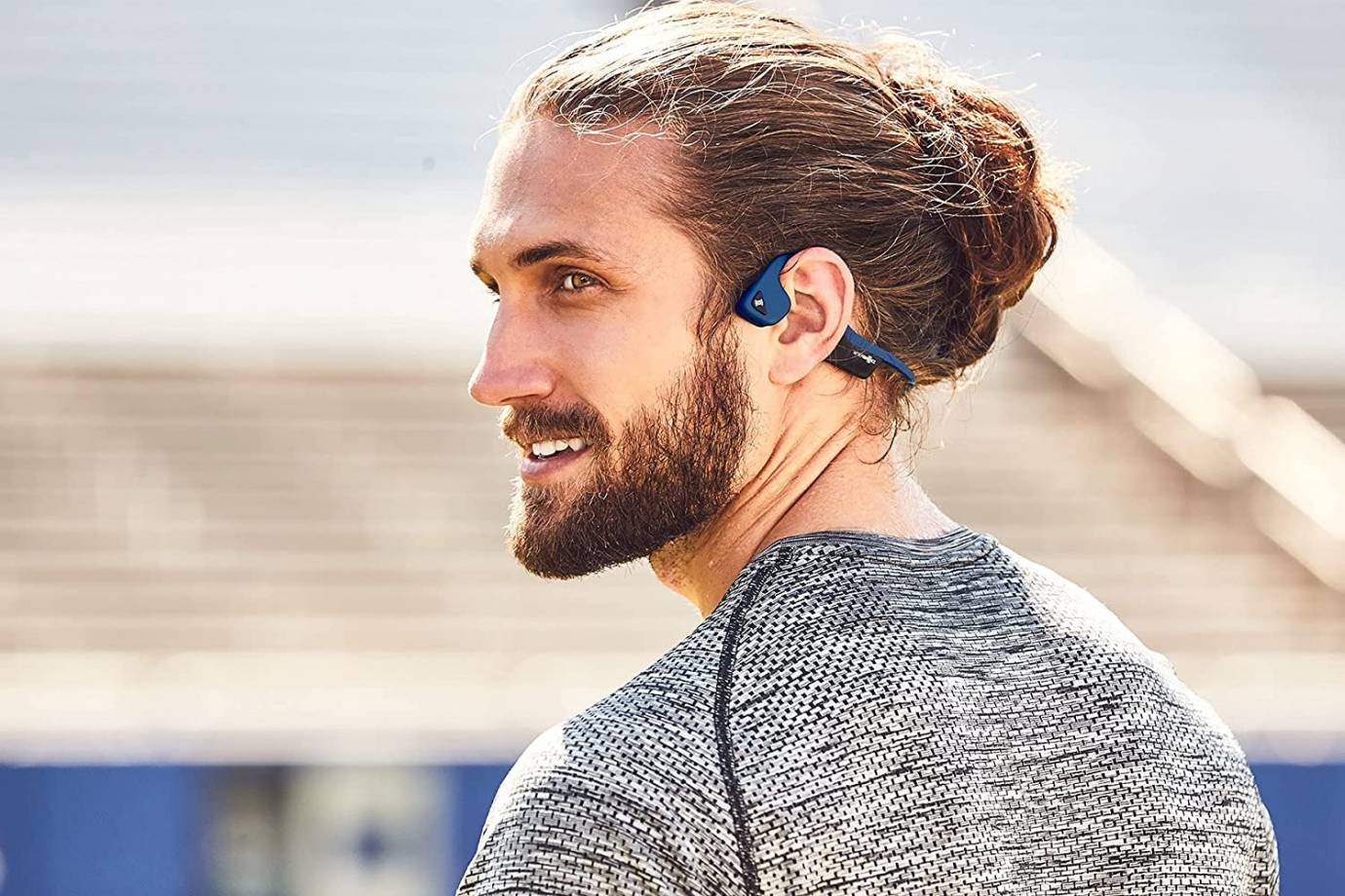 Man wearing a bone conductive listening device
