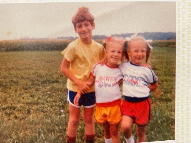 Three kids on a farm