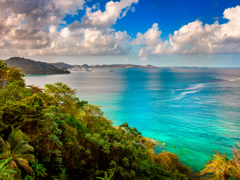 Grand Mal Bay in Grenada with lush hills in front of the turquoise bay