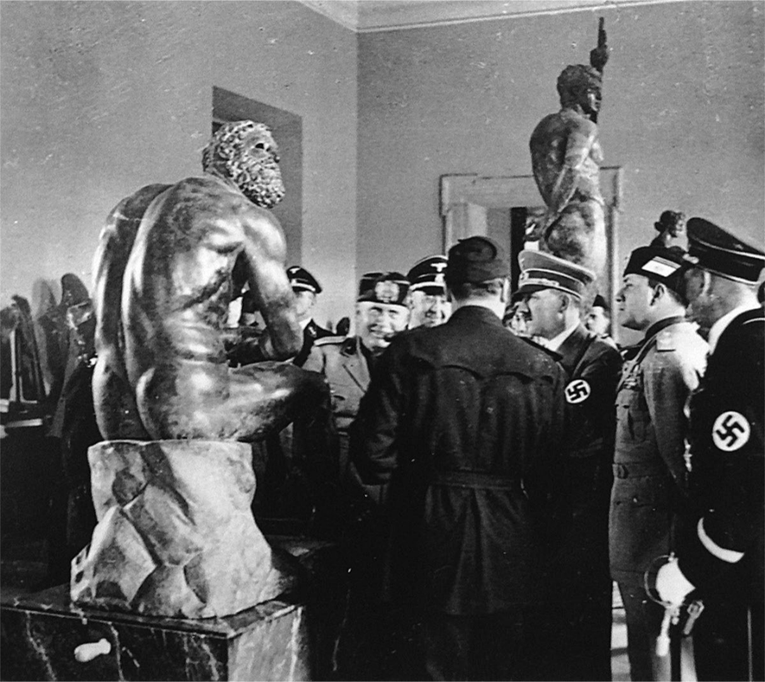 Hitler, Mussolini, and various other fascit apparatchiks looking at the statue in the Terme Museum on 4 May 1938 