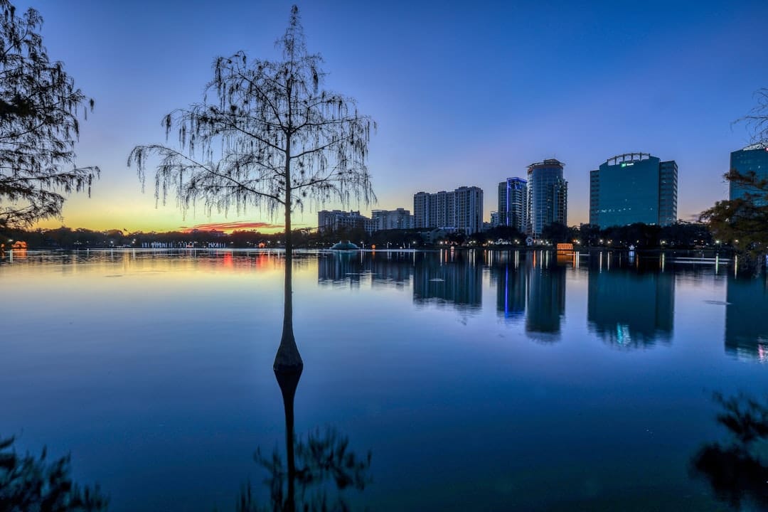 Wide view of Lake Nona Medical City corridor at dusk showing modern healthcare construction and master-planned community streets