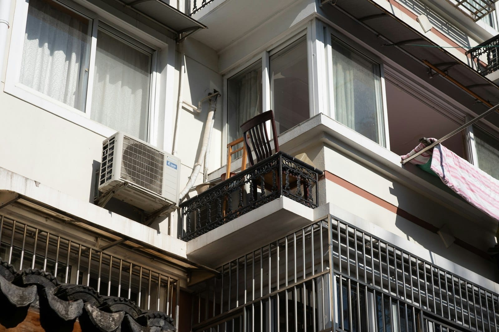 Exterior AC condenser unit beside a Florida rental home