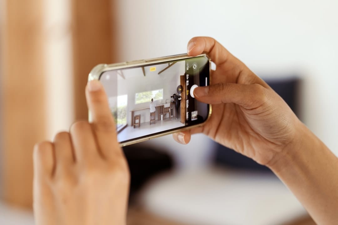 A landlord reviewing a timestamped phone photo of a rental unit's wall condition