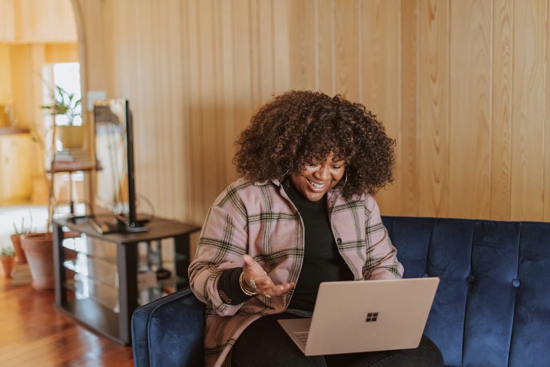 A person reviewing rental listings on a laptop