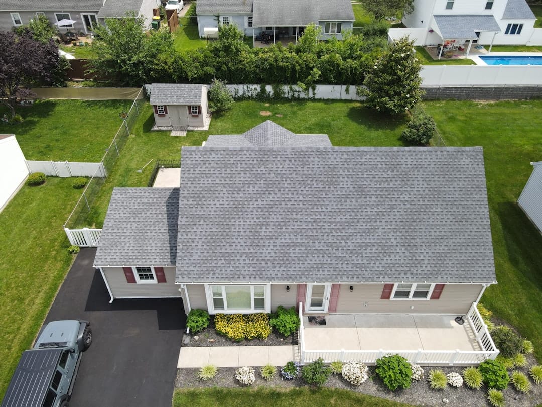 Inspector checking a residential shingle roof in Florida