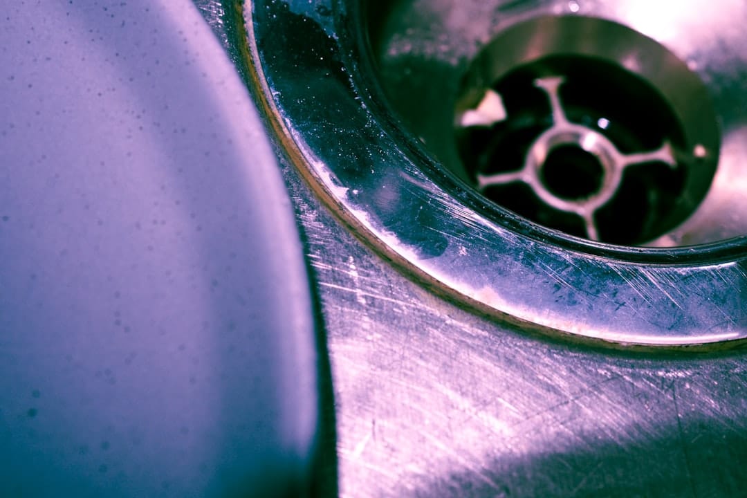 Plumbing under a kitchen sink where a smart leak sensor would be placed