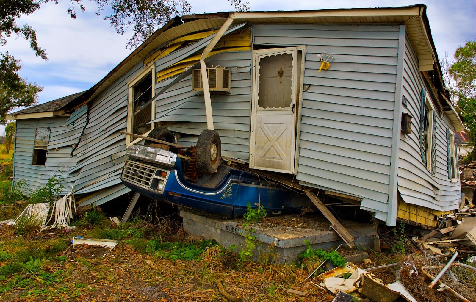 Storm-damaged single-family home exterior