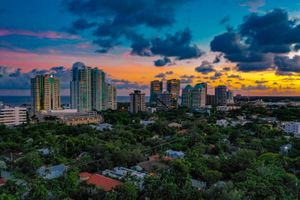Florida residential apartment buildings under a bright sky