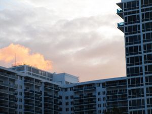 A tall building with a sky in the background