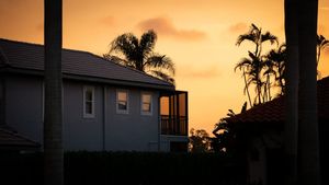 Sun lights up Florida single-family homes at the end of the day, the kind of suburban block Orlando rentals live on