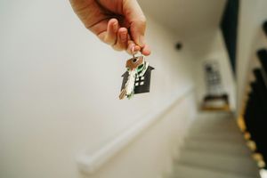 A homeowner holding the key to a Florida rental property