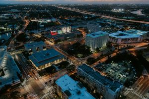 Aerial view of downtown Tampa at dusk with the river beyond