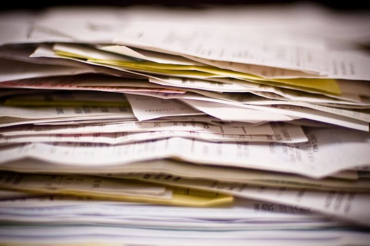 Rental application documents spread on a desk for review
