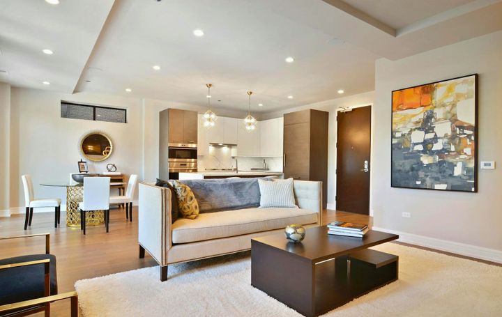 Shared two-bedroom apartment living room with roommate furniture