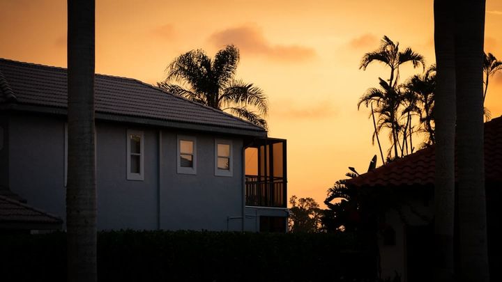 Sun lights up Florida single-family homes at the end of the day, the kind of suburban block Orlando rentals live on