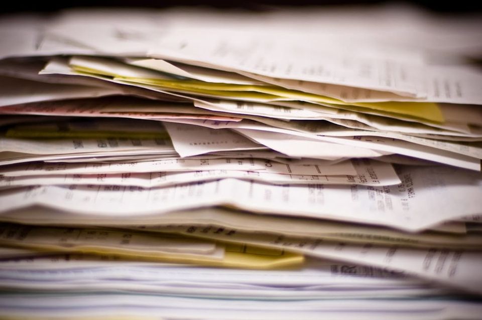 Rental application documents spread on a desk for review