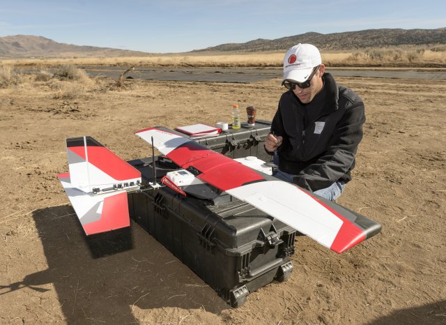 Precision Hawk pilot readies aircraft for test flight. Credits: NASA Ames / Dominic Hart
