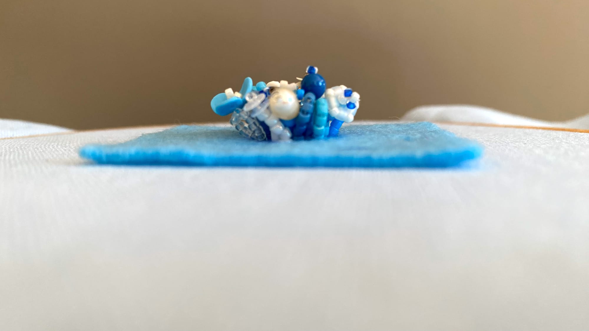 The 3D-beading part of the floral ring. Side view