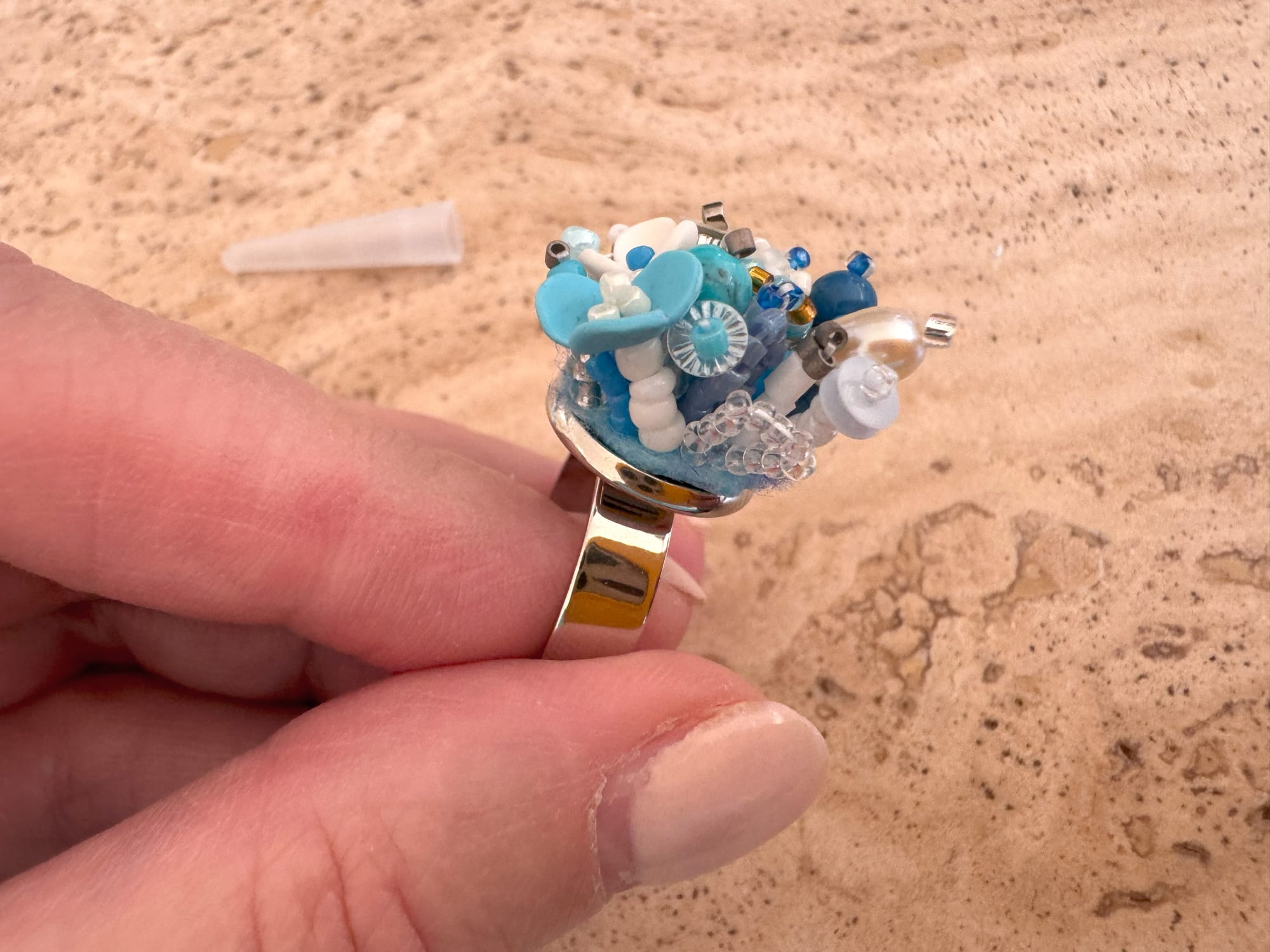 The 3D-beaded element inserted into the ring setting