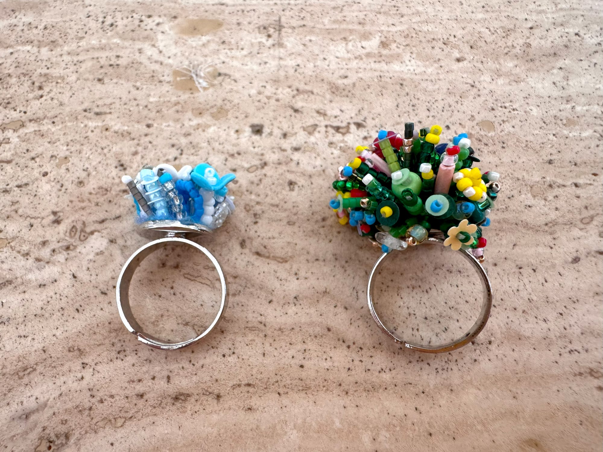 Two 3d-beaded rings: one unfinished and one finished