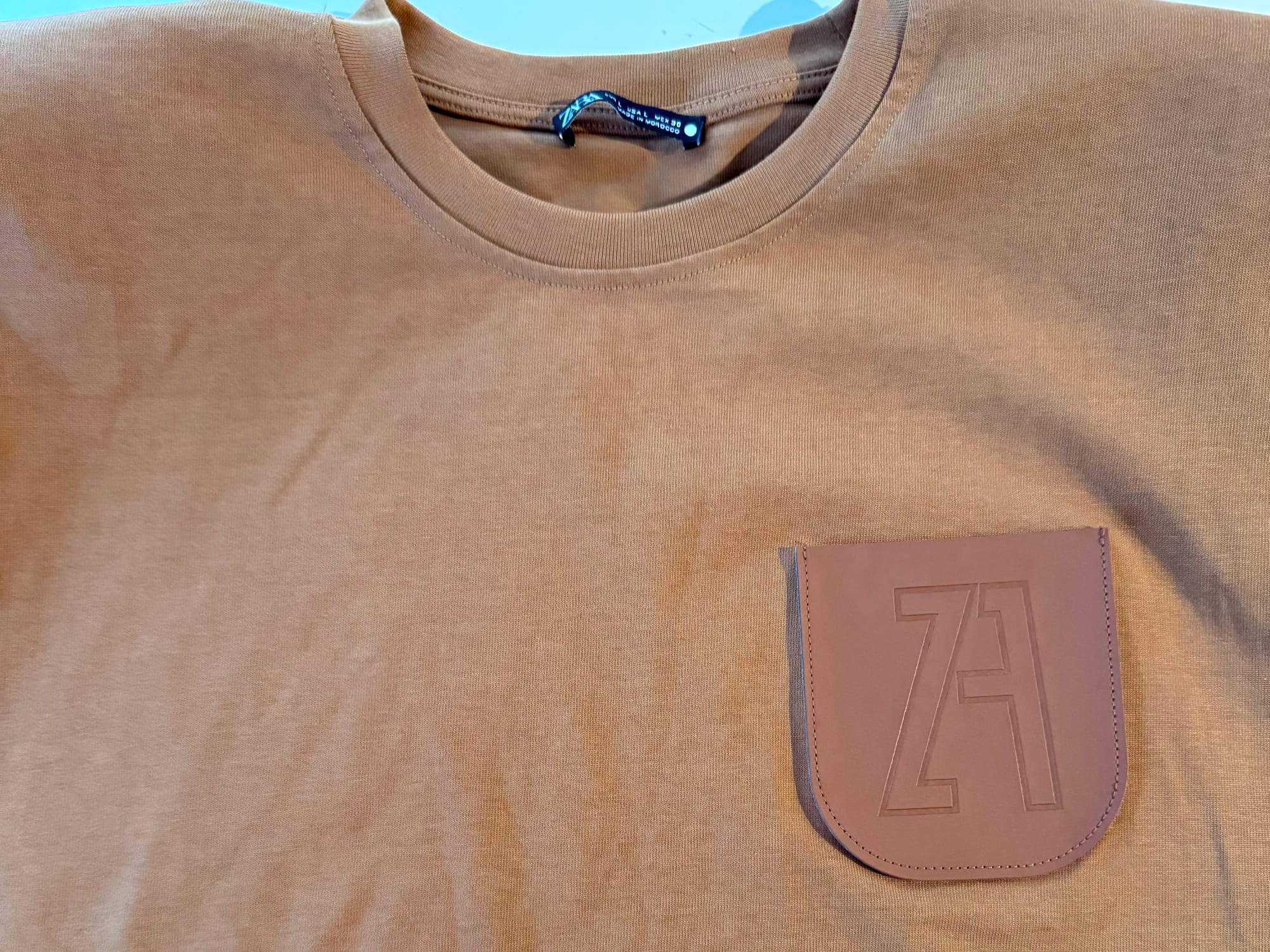 Original blouse with the faux leather pocket