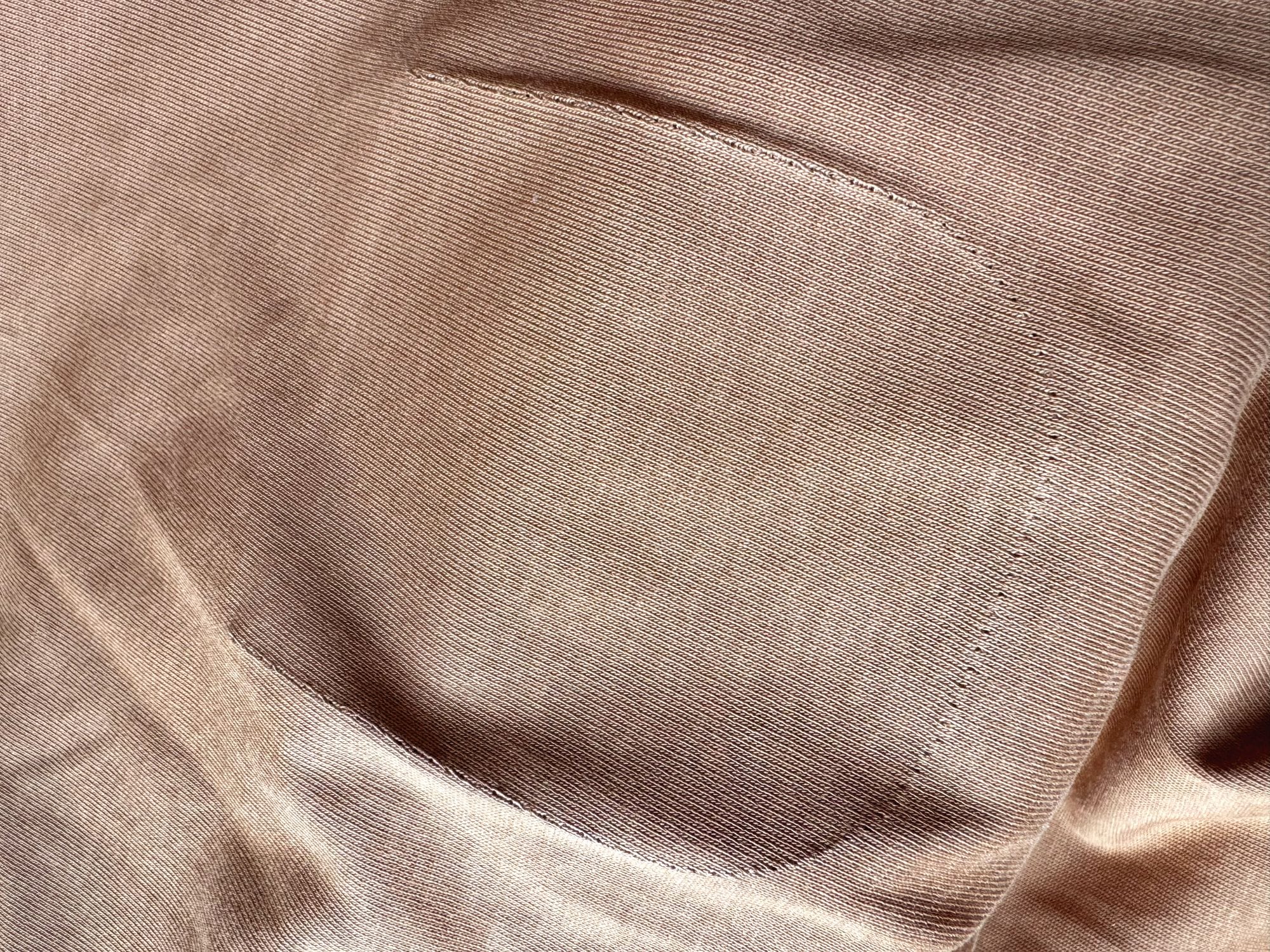 Traces of the place where the original pocket was stitched