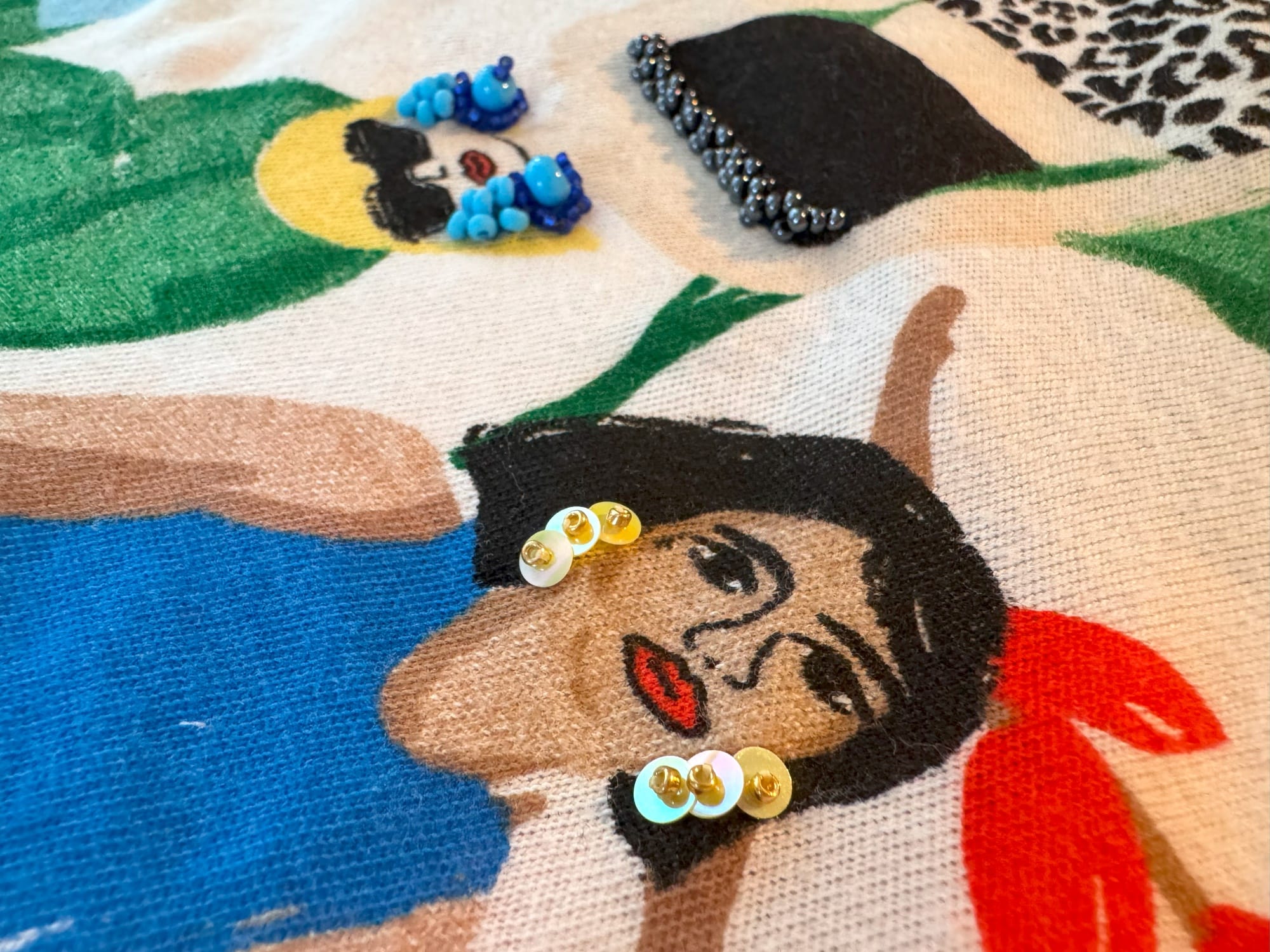 Earrings made from sequins and beads, and from a combination of three different sizes of beads
