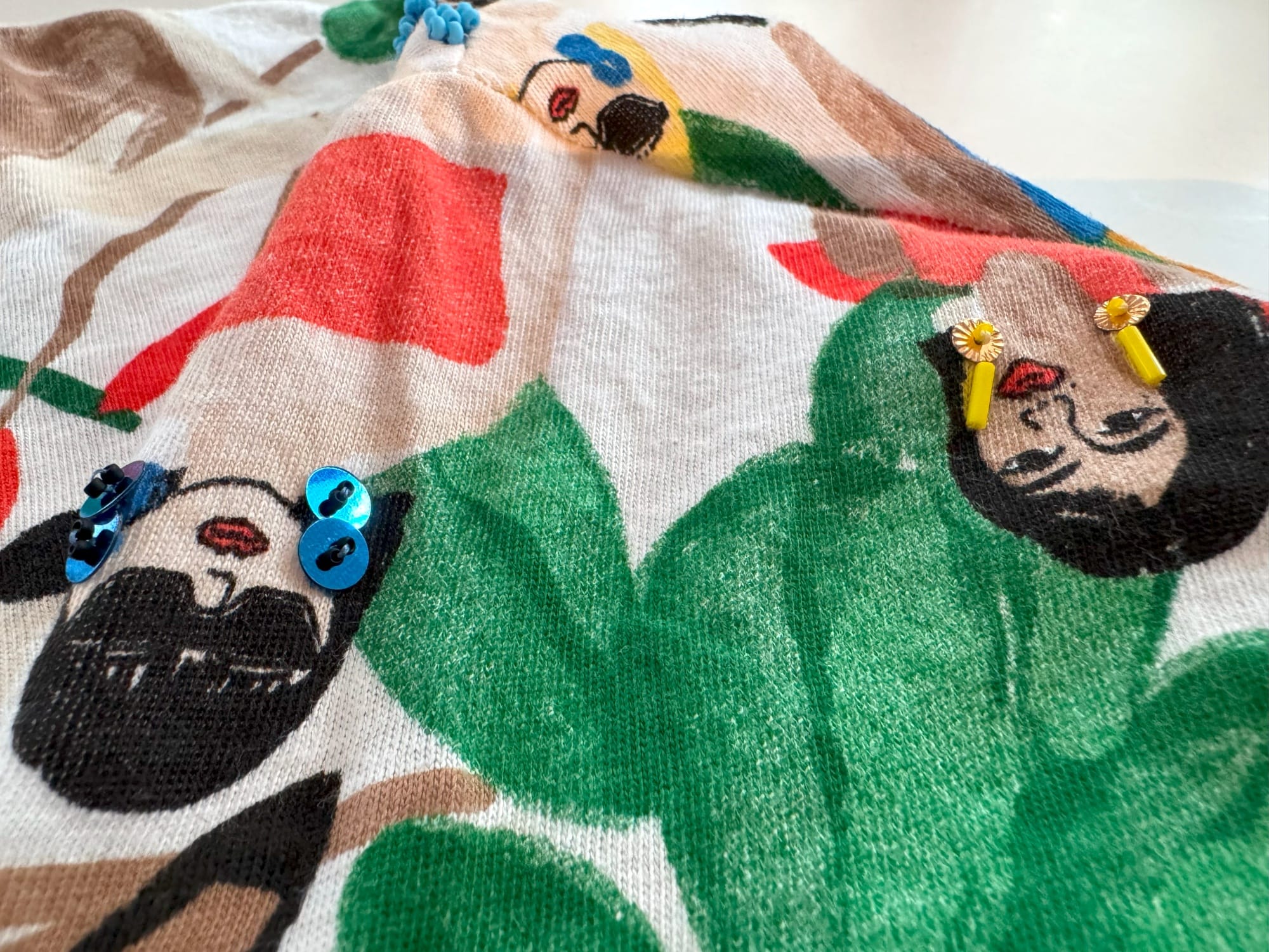 Earrings crafted from sequins, bugle beads, and Toho beads