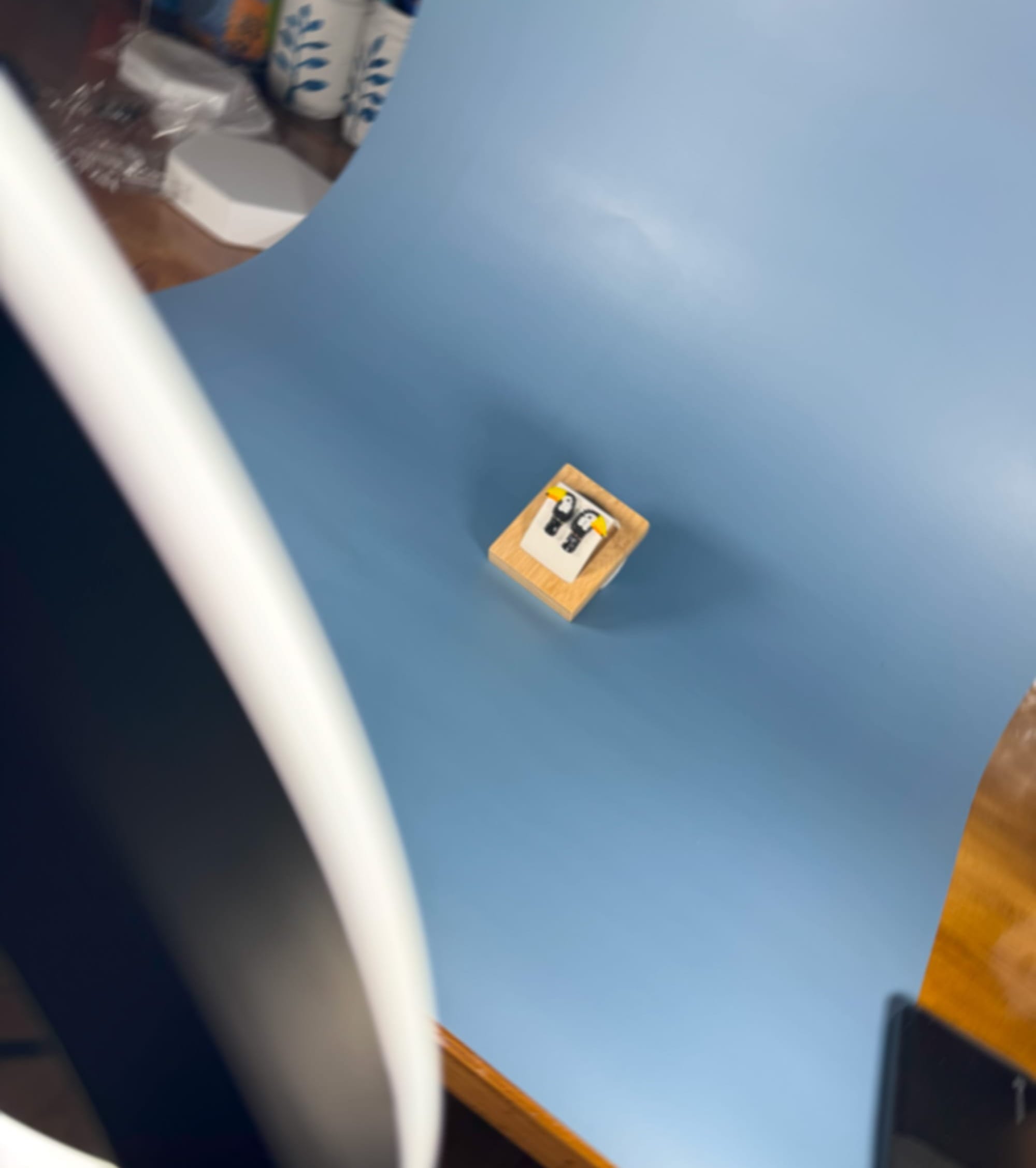 Background connected to holder located on a table.