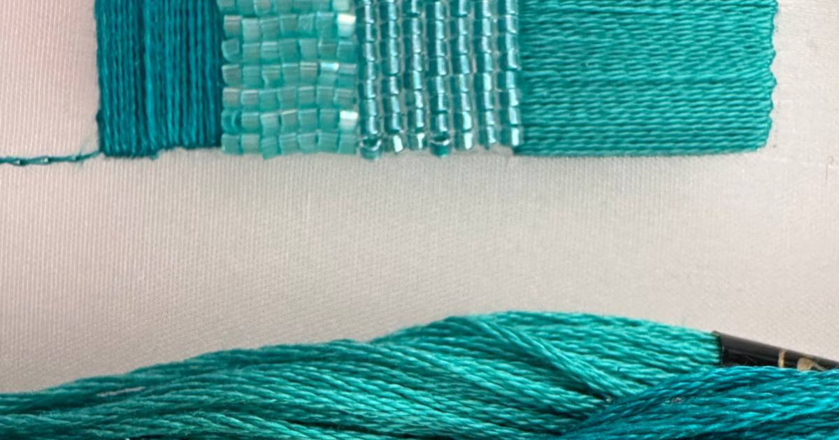 Teal DMC and Anchor embroidery thread and Miyuki Delica beads compared with a small embroidered example.
