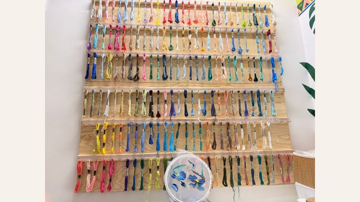 Thread display beside the words: Third time’s the charm. We hope. Behind the DMC, Anchor and Miyuki matching.