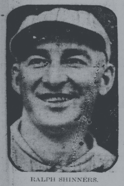 Portrait of Ralph Shinners from a 1920s newspaper clipping, smiling in a baseball cap during discussion of his shortened major league career after a bean-ball injury.