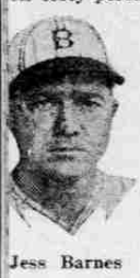 A vintage, close-up, black-and-white newspaper headshot of baseball player Jess Barnes from 1926. He is wearing a light-colored baseball cap with a dark, stylized letter "B" on the front, representing the Brooklyn Robins. He has a serious expression, looking directly at the camera. The image is grainy, characteristic of early 20th-century newsprint, with his name "Jess Barnes" printed clearly at the bottom.