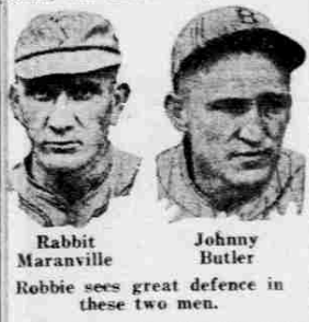 A grainy, vintage black-and-white newspaper photograph from 1926 featuring the headshots of two baseball players. On the left is Rabbit Maranville, wearing a light-colored baseball cap and a dark jersey, looking forward with a serious expression. On the right is Johnny Butler, also in a baseball cap and jersey, appearing to look slightly to the side. Below the images, their names are printed as "Rabbit Maranville" and "Johnny Butler," followed by the caption: "Robbie sees great defence in these two men".