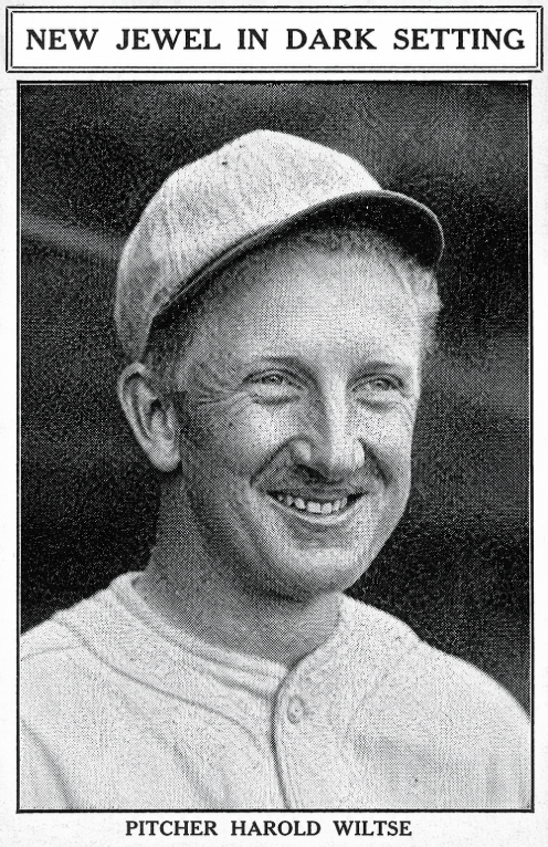 1926 newspaper portrait of Boston Red Sox pitcher Harold Wiltse smiling in uniform. Image is an AI-assisted reconstruction based on a degraded newspaper scan and is not an untouched historical photograph.