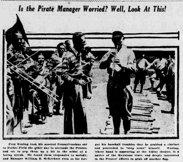 Fred Waring plays clarinet for Pirates manager Bill McKechnie and others outside Forbes Field during the 1926 season as Pittsburgh sought to rebound in the National League pennant race.