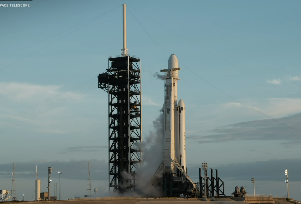 The Nancy Roman Space Telescope atop the Falcon Heavy launch vehicle on launch day, August 30, 2026. The lightning tower is clearly visible on top of the Fixed Service Structure. (NASA photo)