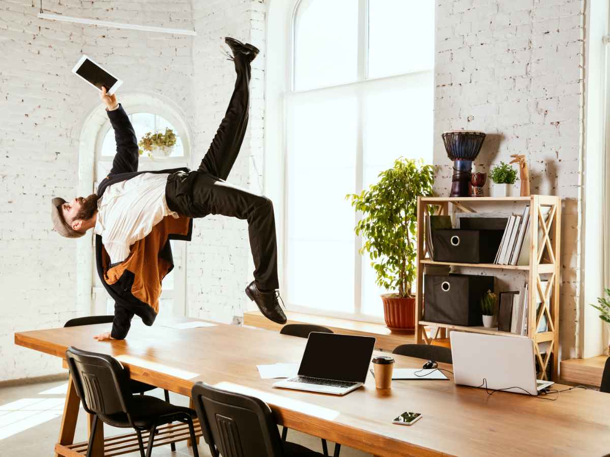 A man is having a lot of fun at work because he has his day sorted out.