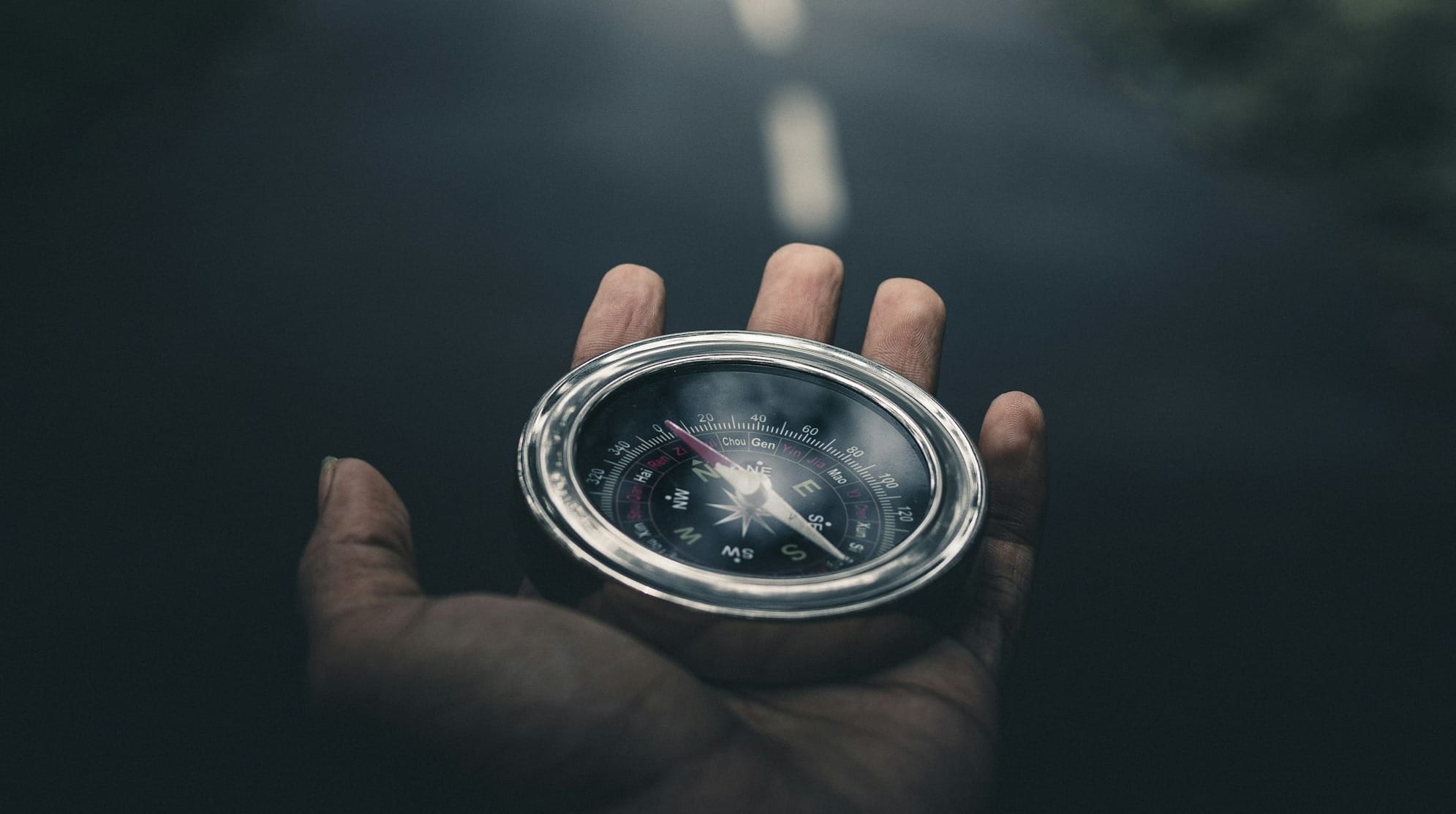 person holding silver round container