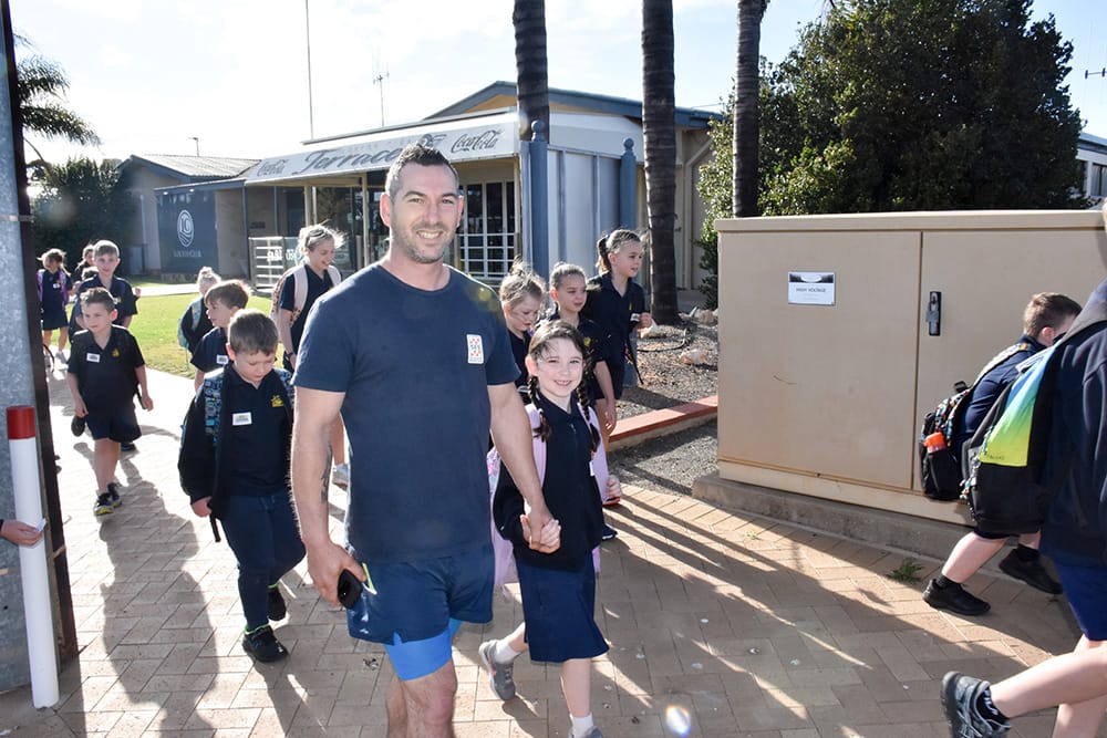 Local students lace up to walk safely to school