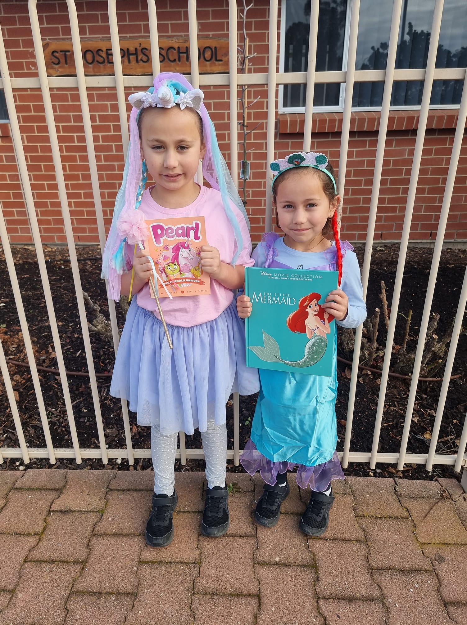 St Joseph's School Renmark students Emmie, 8, and Abbey Smith, 6, as Pearl the Friendly Unicorn and The Little Mermaid. 
