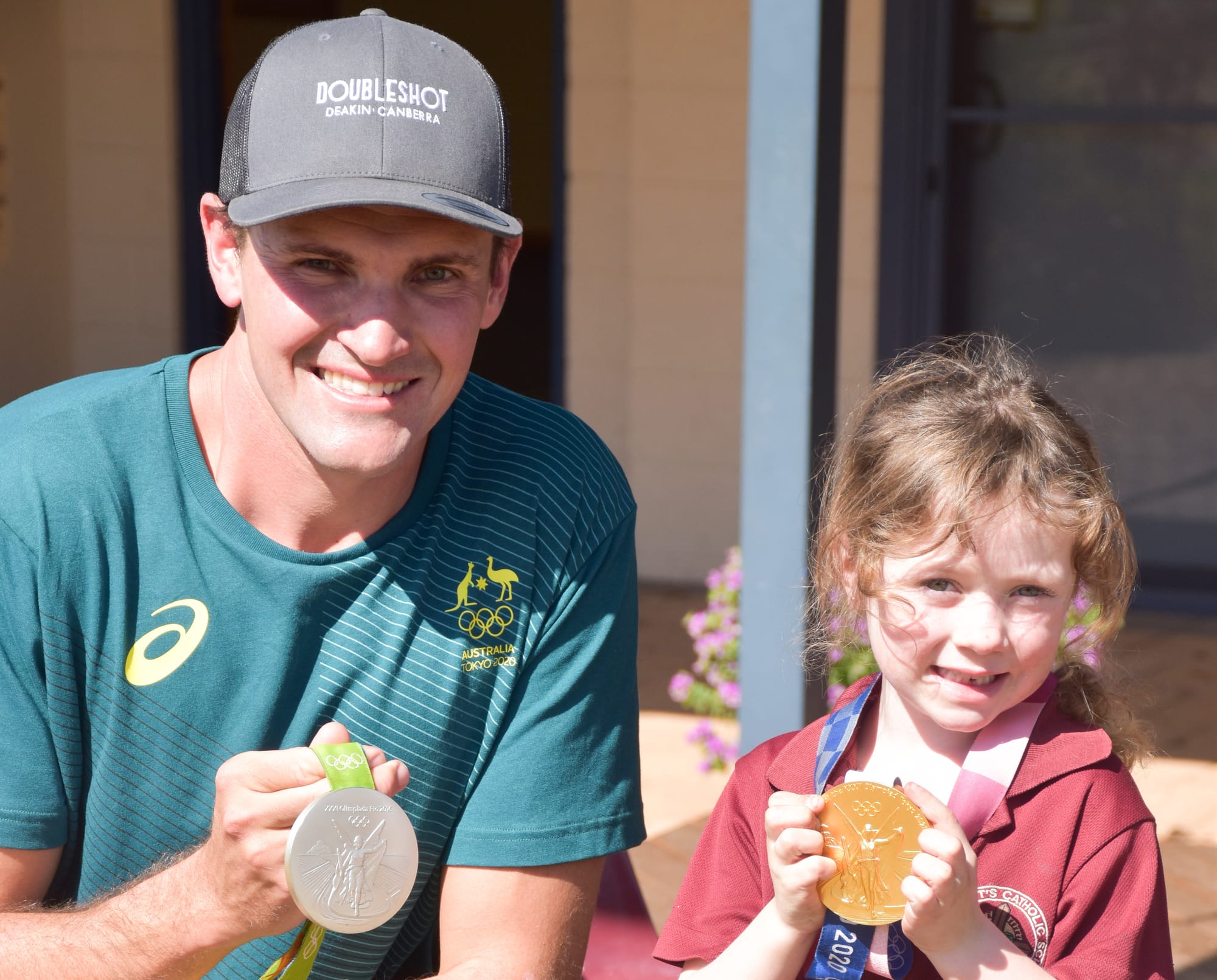 Golden boy Hill visits former school