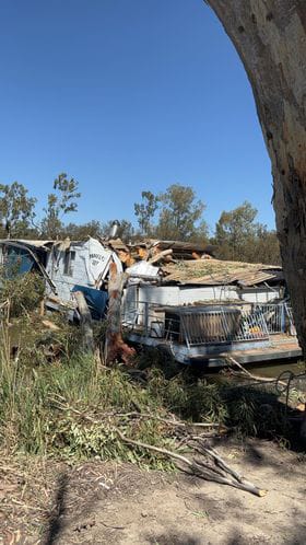 Houseboat destroyed by fallen tree