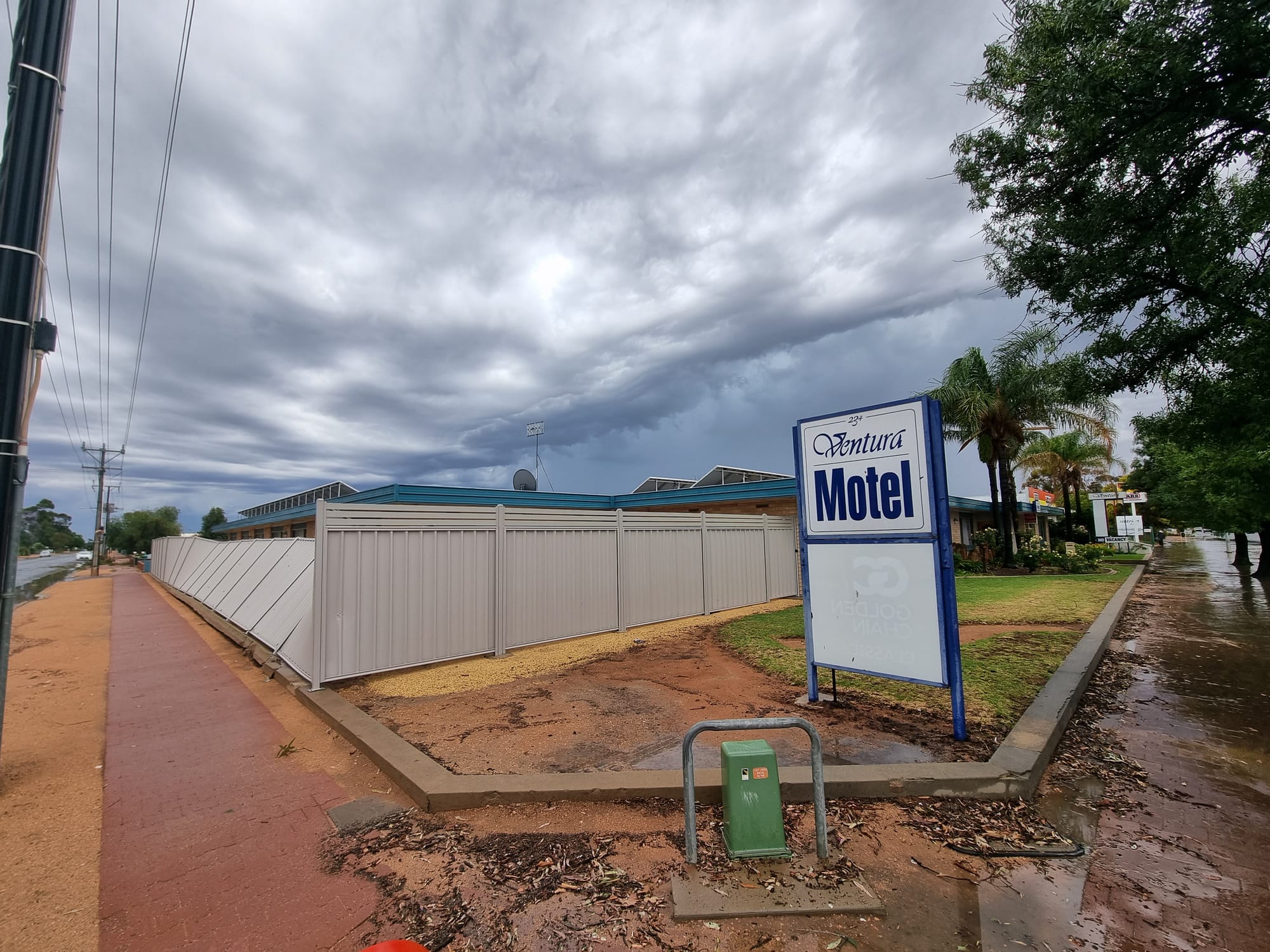 The storm toppled a fence at the Ventura Motel.